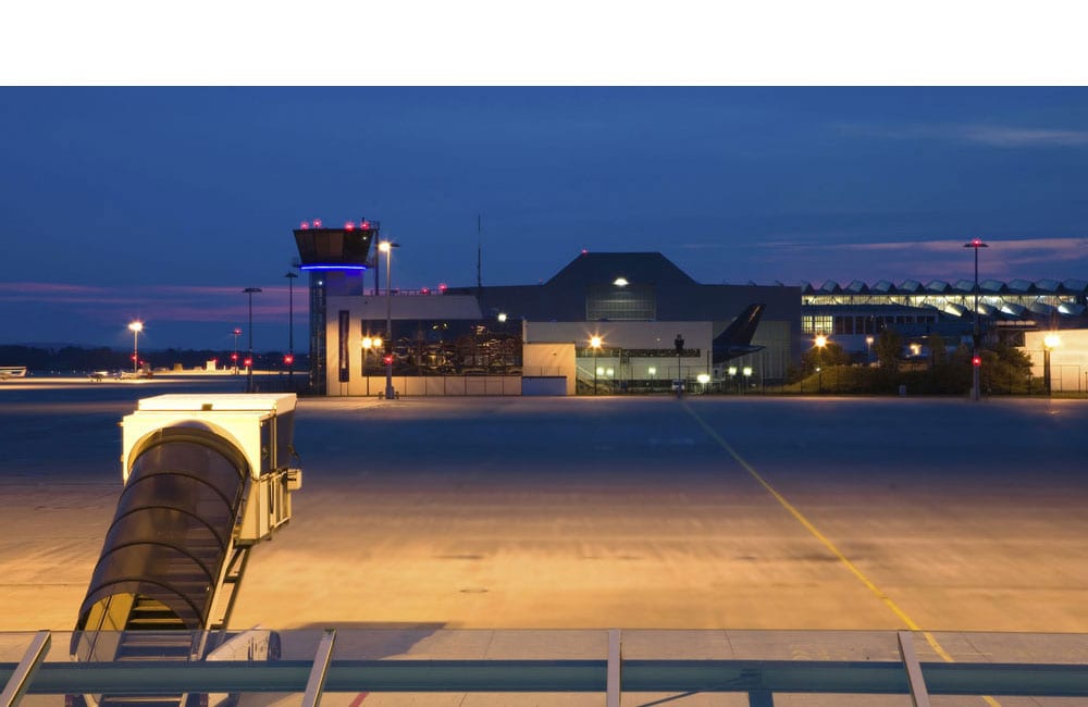 Aircraft apron and control tower at dusk